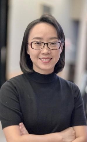 A person wearing glasses  Description automatically generated with low confidence